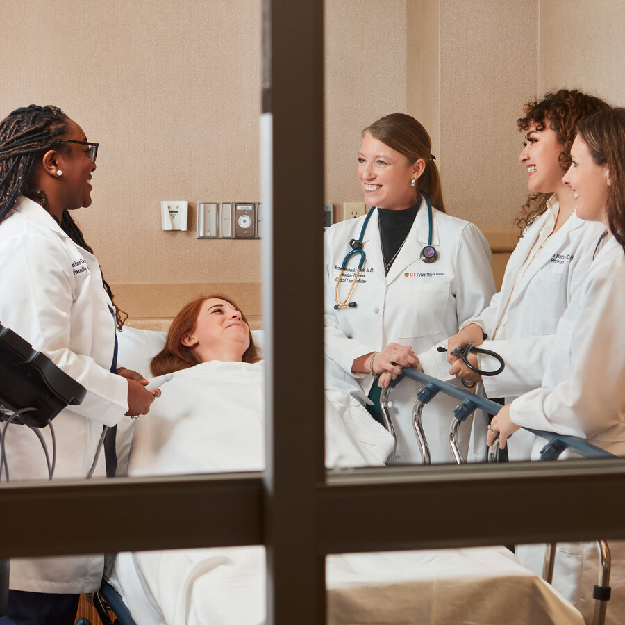 A group of fellows and interns from The University of Texas at Tyler's School of Medicine observe a patient