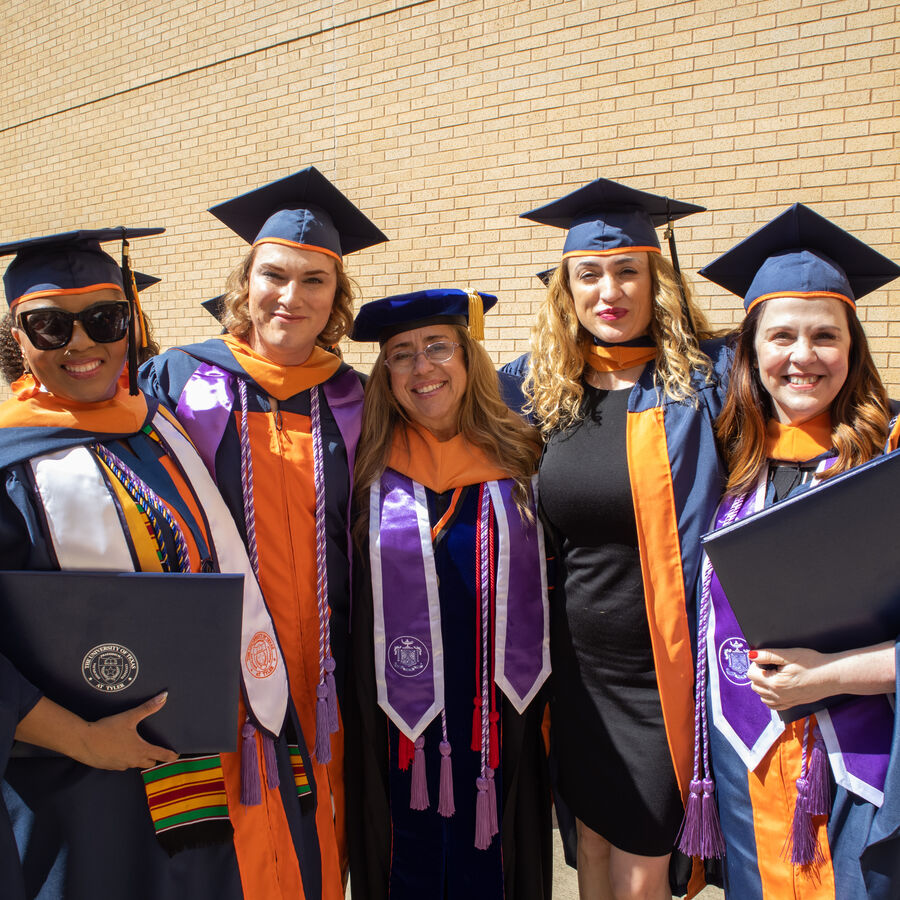 Graduates from The University of Texas at Tyler's School of Nursing hold their diplomas during convocation