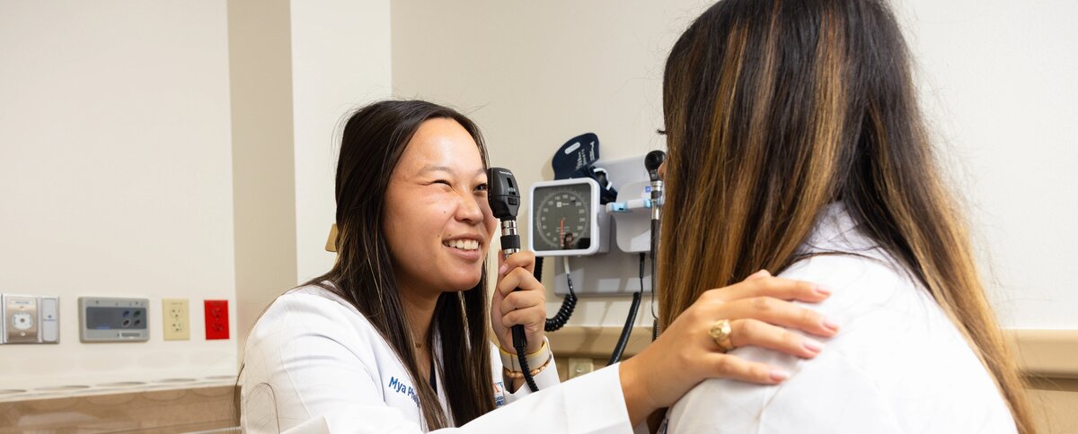 Medicine student using a ophthalmoscope