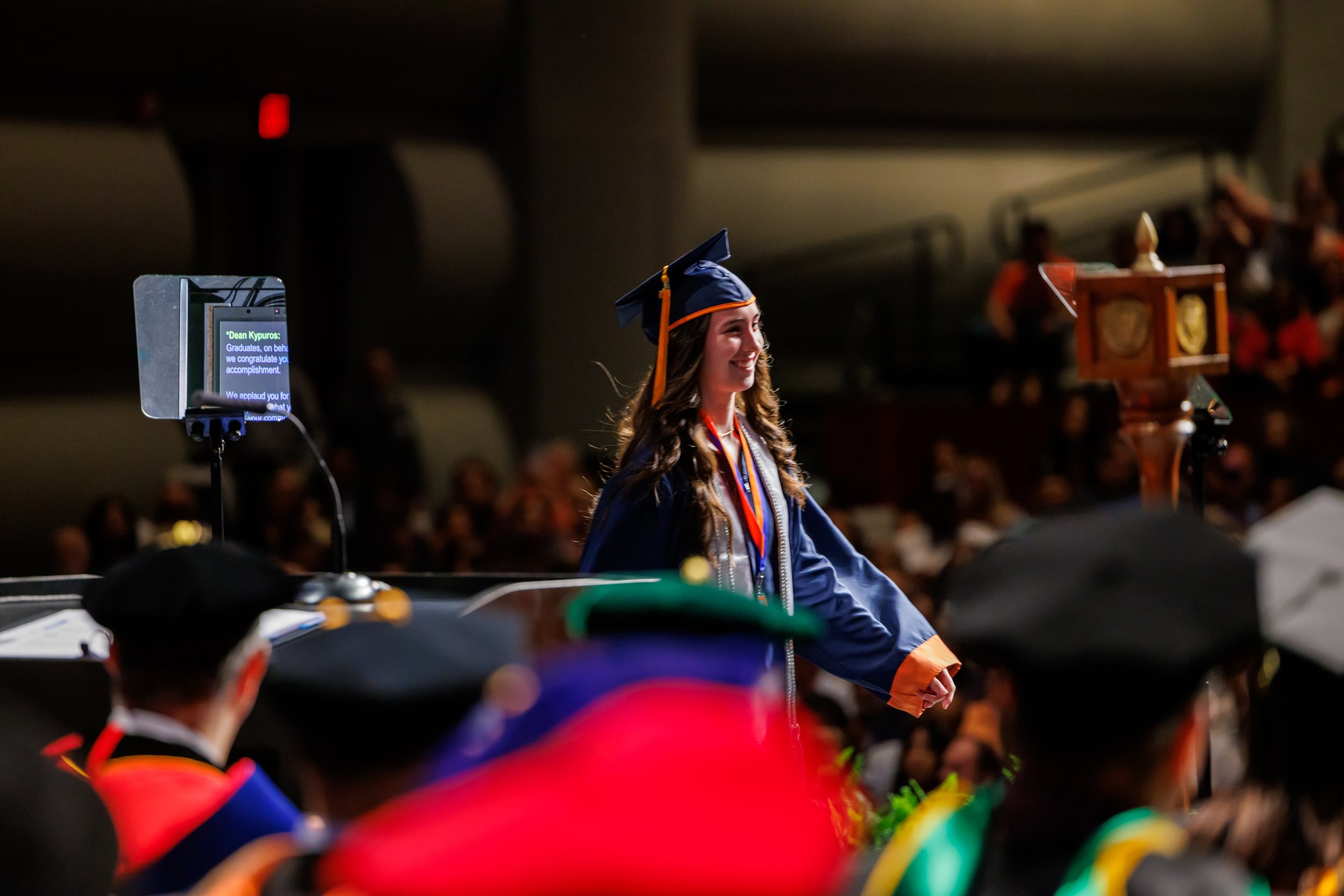 Graduate walking across the stage during commencement