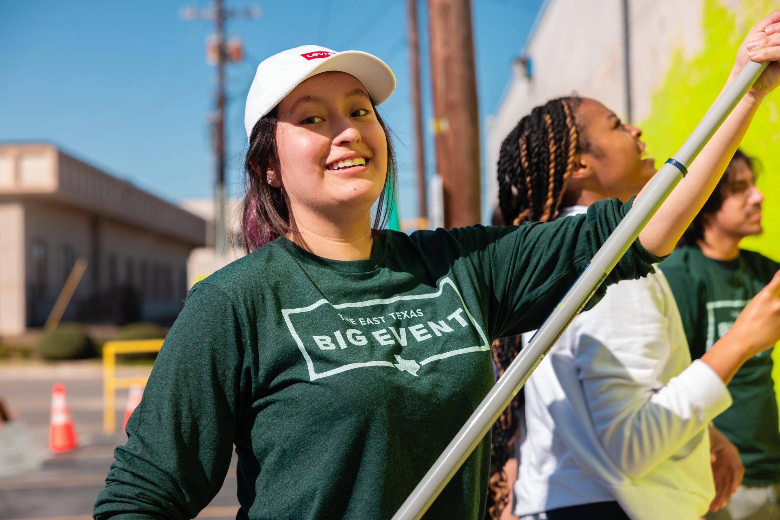 Students conducting community service at previous Big Event