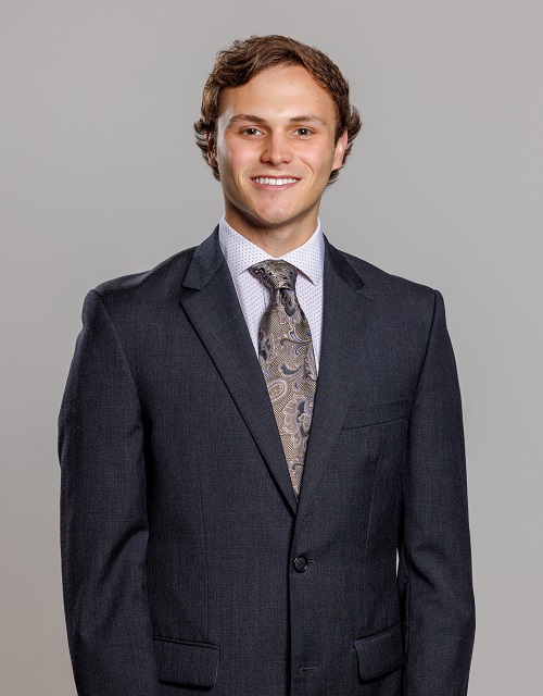 man in a suit, smiling