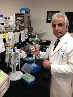 Azghani in his lab