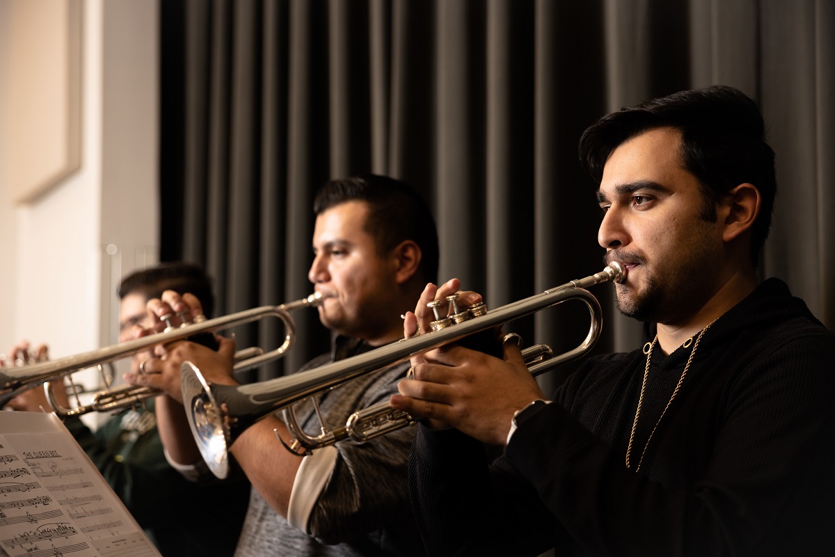 Students playing trumpets