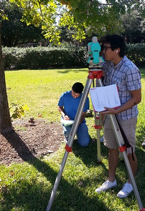 1) In Geomatics lab, a UT Tyler student is taking land surveying measurements using Total Station (Geomatics course).
