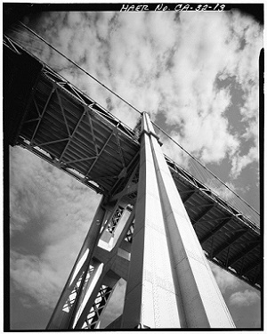 A view looking up at the support structure of the Oakland Bay Bridge