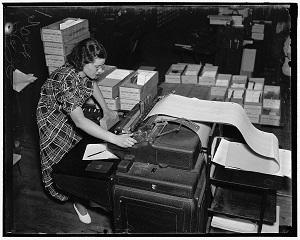 A records keeper with long spool of paper