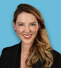 woman, smiling, wearing a business suit jacket