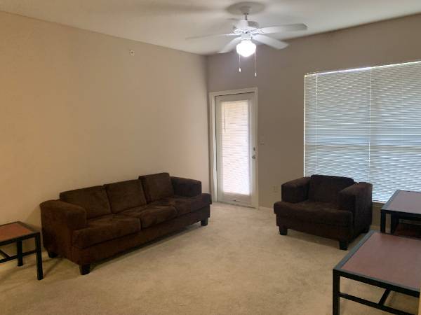 Two brown couches in a living room