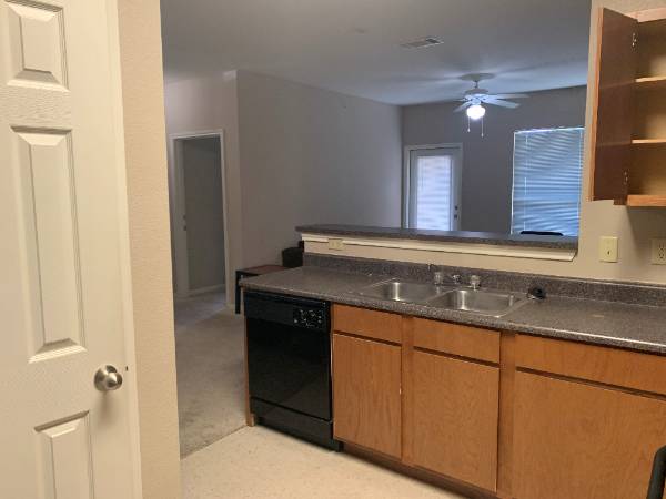 Kitchen view of sink and living room