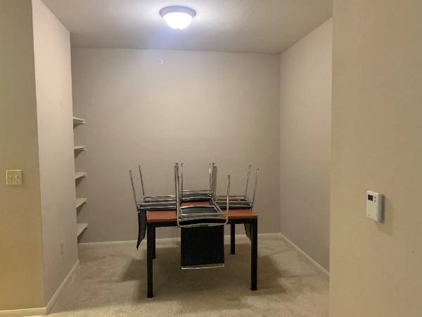 Kitchen Table with chairs on top of it