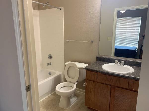 Bathroom with toilet, shower and sink