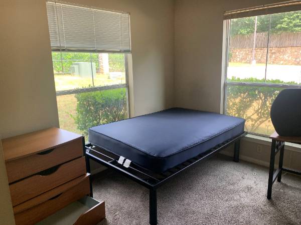 Bedroom with windows in background